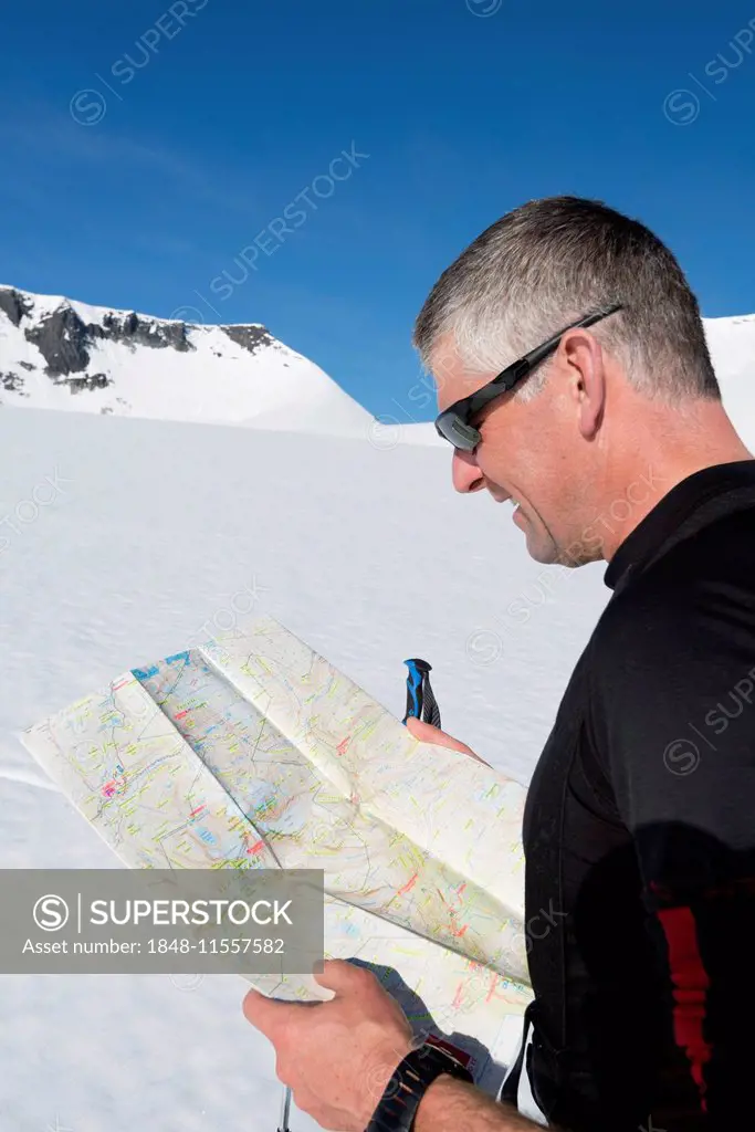 Mountaineer with orientation map, Oppland, Norway
