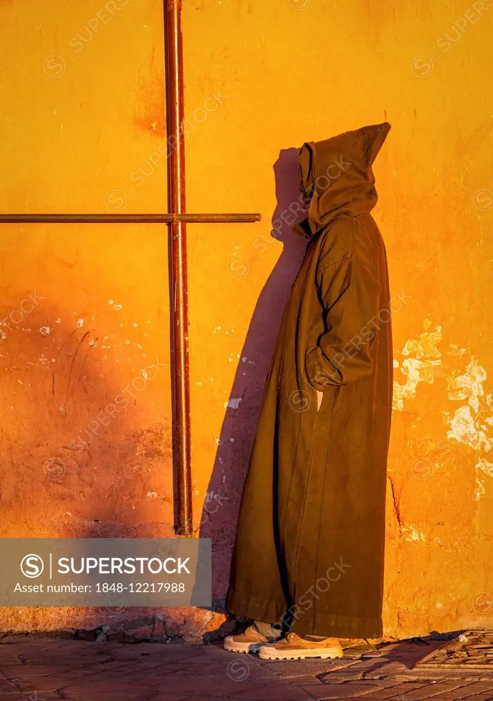 A Moroccan man wearing a typical Djellaba, Marrakesh, Morocco