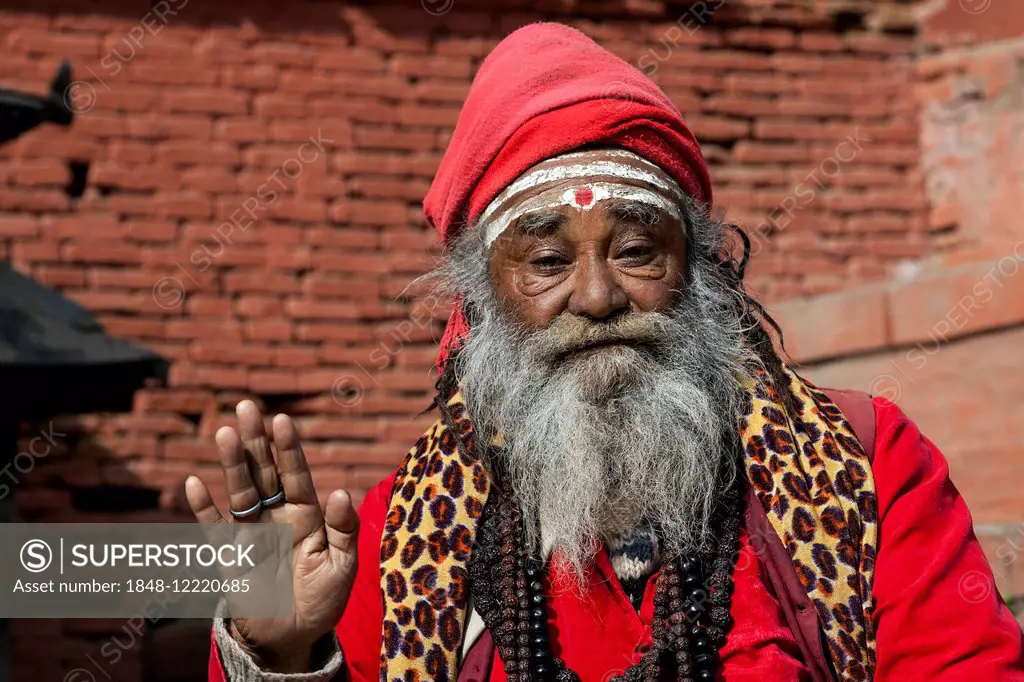 Sadhu, red turban and clothing, portrait, Kathmandu, Nepal