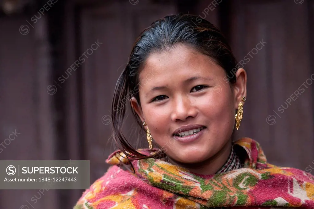 Young Nepali woman with earrings, portrait, Bhaktapur, Nepal
