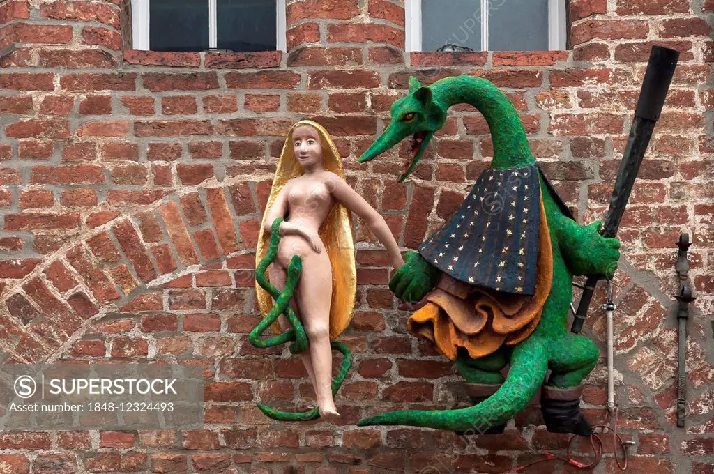 Figures of a dragon and a woman on the façade of the former Hieronymus Restaurant & Café, Lübeck, Schleswig-Holstein, Germany