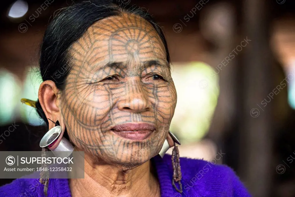 Woman with a traditional facial tattoo and ear jewelry, ethnic group of the Chin, ethnic minority, portrait, Rakhine State, Myanmar