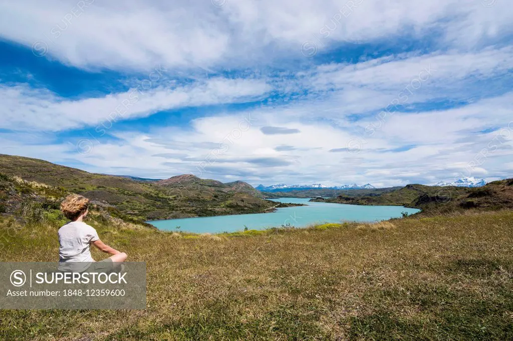 Woman enjoying the view of a glacier lake, Torres del Paine National Park, Patagonia