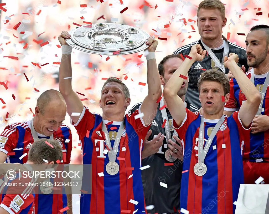 Championship celebration, Bastian Schweinsteiger with championship trophy, joy at FCB, FC Bayern is 24. German champion, Allianz Arena, Munich, Upper ...