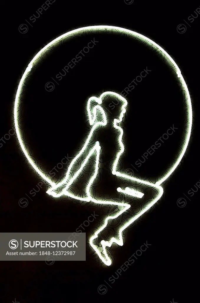 Neon sign, girl in hoop on a dark wall, Nuremberg, Middle Franconia, Bavaria, Germany, Europe