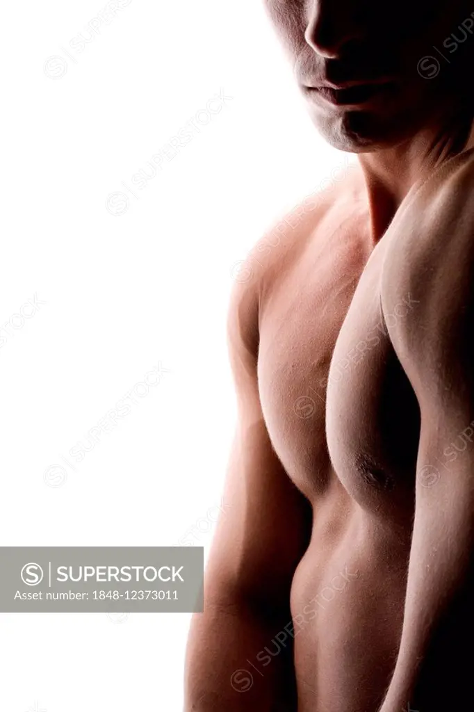Naked torso of a man with backlighting