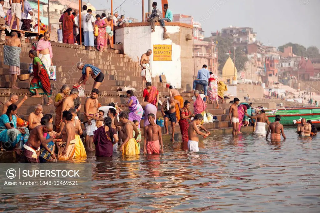 Hindu believers having a bath in the Ganges river in the morning, Varanasi, Uttar Pradesh, India