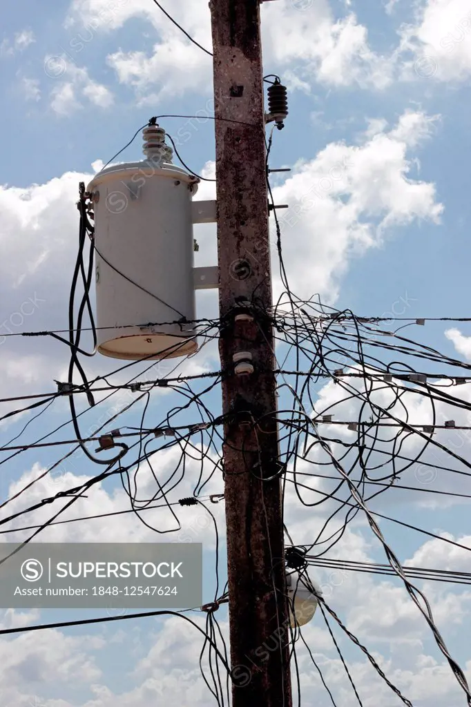 Many electricity wires and a transformer on a pole, Zapata Peninsula, Cuba
