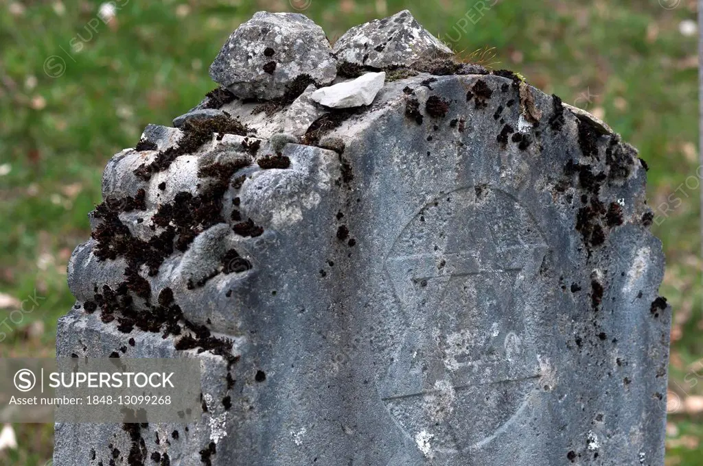 Visitors' stones on an ancient Jewish grave stone with Jewish star, Ermreuth, Upper Franconia, Bavaria, Germany