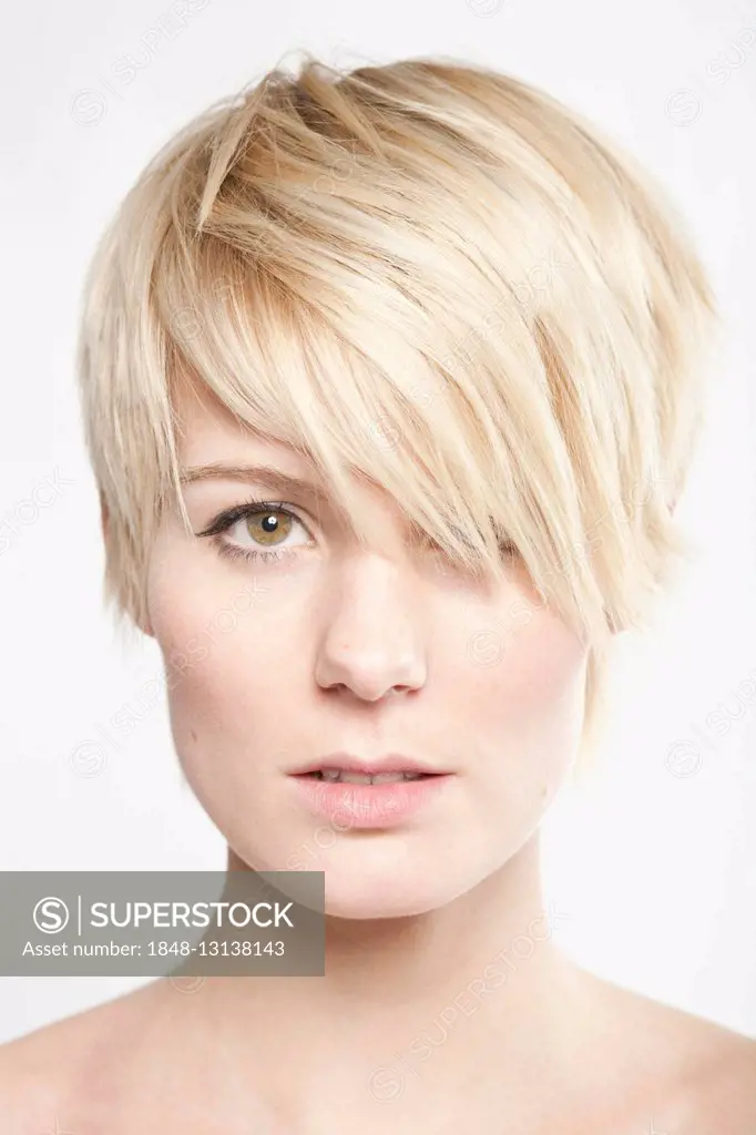Young blond woman with short hair looking into the camera