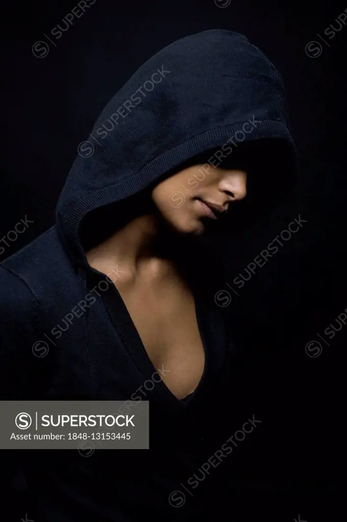 Dark-skinned, hooded woman