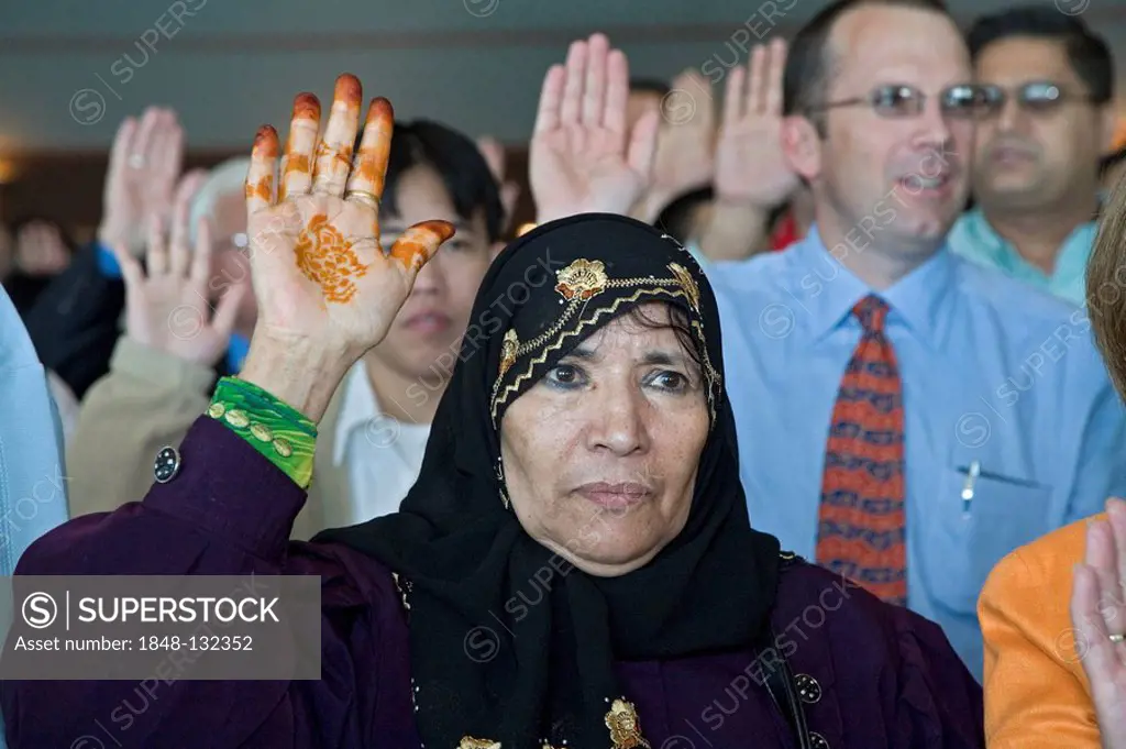 A woman from Yemen is one of 600 immigrants sworn in as new citizens of the United States, Detroit, Michigan, USA