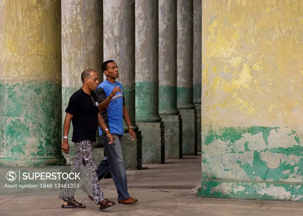 Two local men walking past, Old Havana, Havana, Cuba