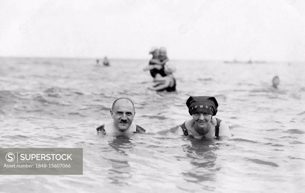 Married couple on holiday swimming in the sea, ca. 1920s, Rügen, Baltic Sea, Germany