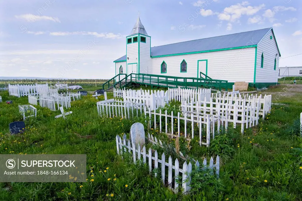 Historic graveyard and wooden church in Fort McPherson, Lost Patrol, arctic village, Northwest Territories, Canada, North America
