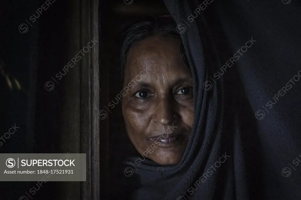 Widow of a fisherman in her house, Mongla, Sundarbans, Bangladesh, Asia