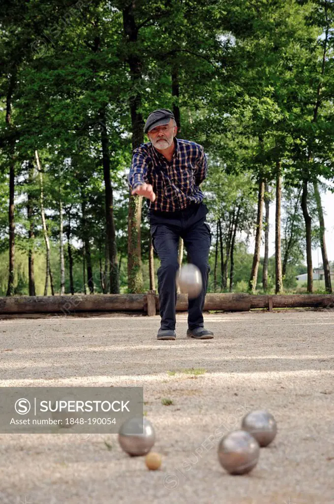 Man playing Boules, Petanque, Provence, Southern France, France, Europe