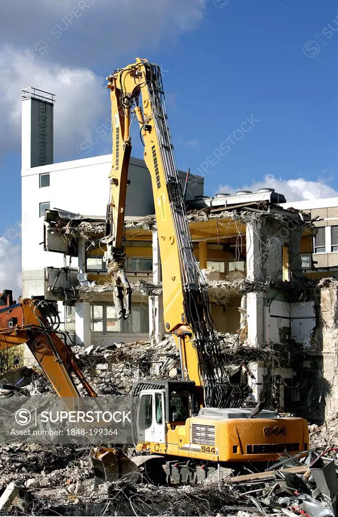 Wrecking excavator at a demolition site