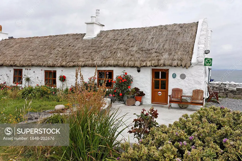 Cottage with typical straw roof, Inis Mor, Aran Islands, Ireland
