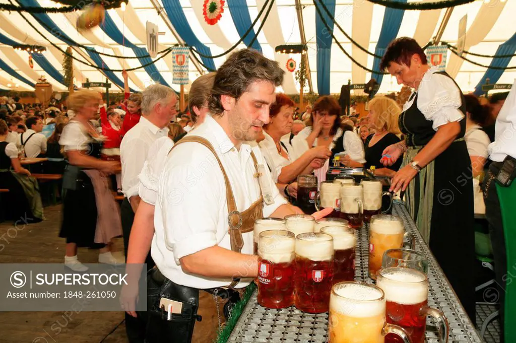 Attendees and wait staff in a beer tent at an international festival for national costume, Muehldorf, Upper Bavaria, Bavaria, Germany, Europe
