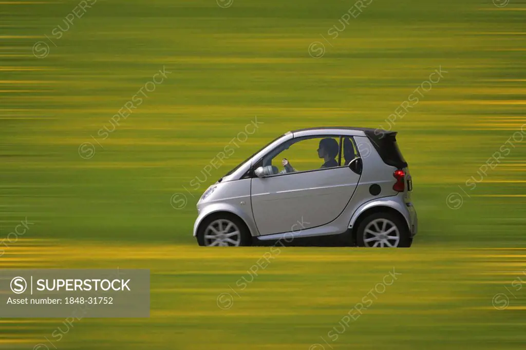 Smart car driving on a country road