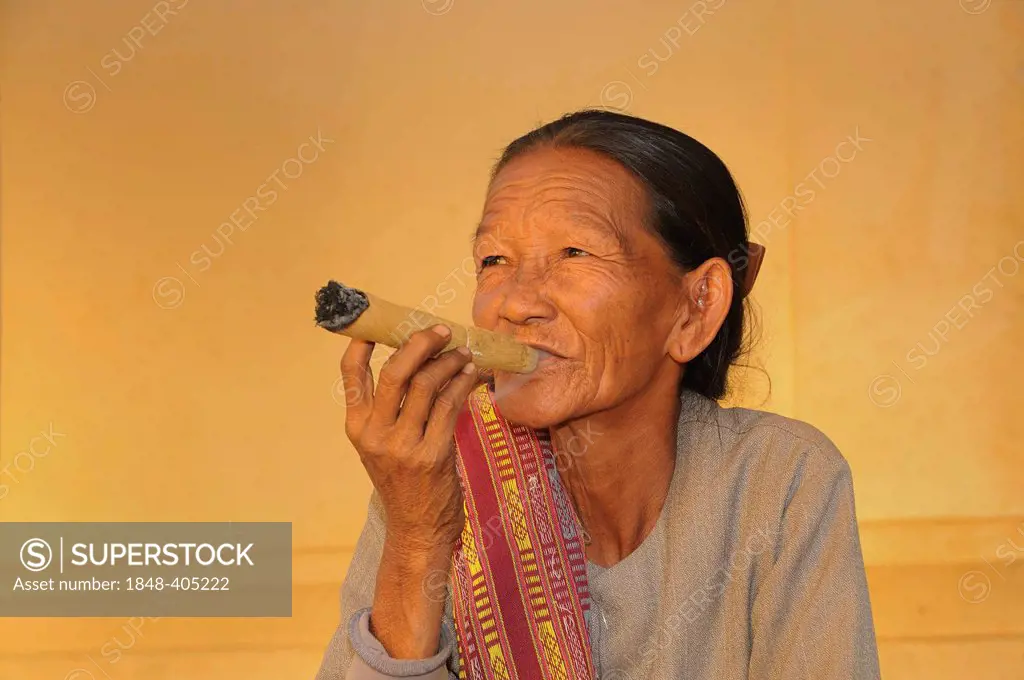 Cheroot, old woman smoking a typical cigar made of corn leaves in Myanmar, Bagan, Myanmar, Burma, Southeast Asia, Asia