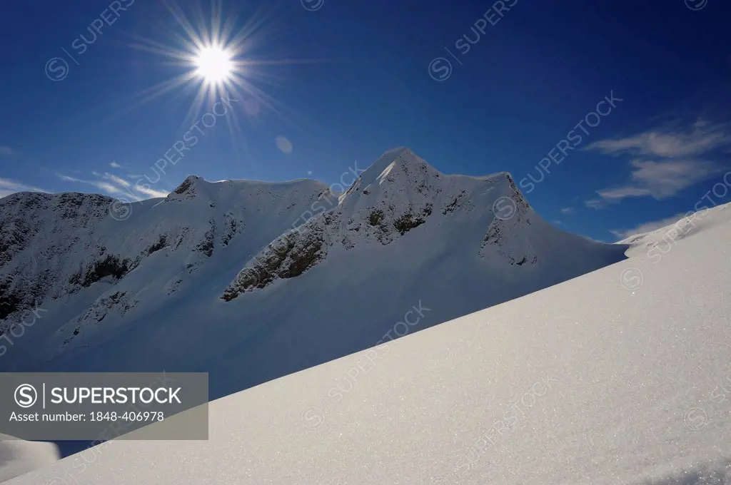 Sun and blue sky with snow covered mountains, Hinterstein, Upper Allgau, Bavaria, Germany, Europe