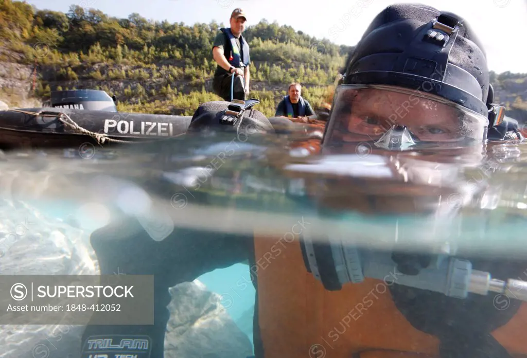 Police divers doing a search in a lake, Germany, Europe