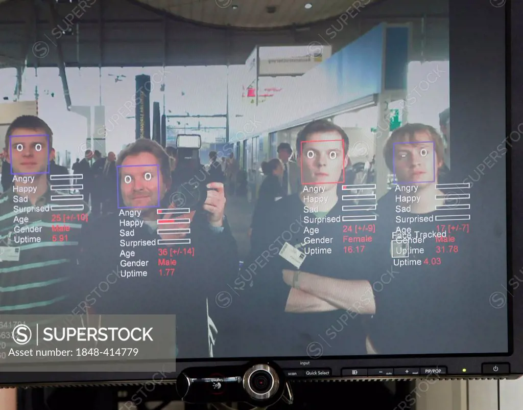 Monitor displaying a facial recognition software devised by the Fraunhofer Institute, Hall 9, computer recognises face and can determine age, sex and ...