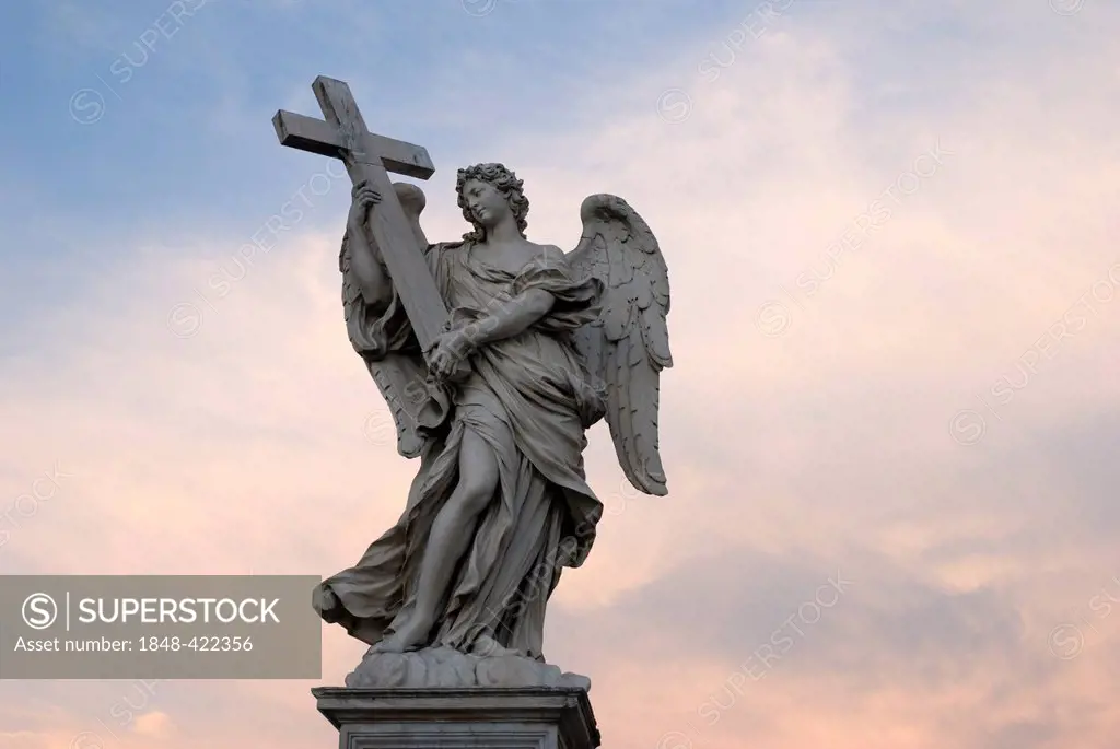Angel statue on Ponte Sant'Angelo, Angel's Bridge, in evening light, Rome, Italy, Europe