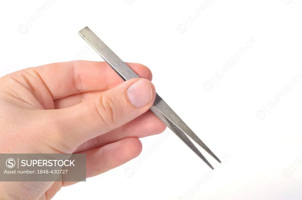 Hand holding a pair of tweezers