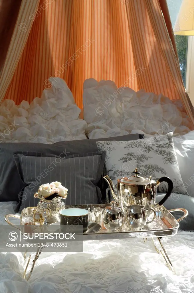 Silver breakfast tray in a canopy bed, Villa & Ambiente, Im Weller 28, Nuremberg, Middle Franconia, Bavaria Germany, Europe