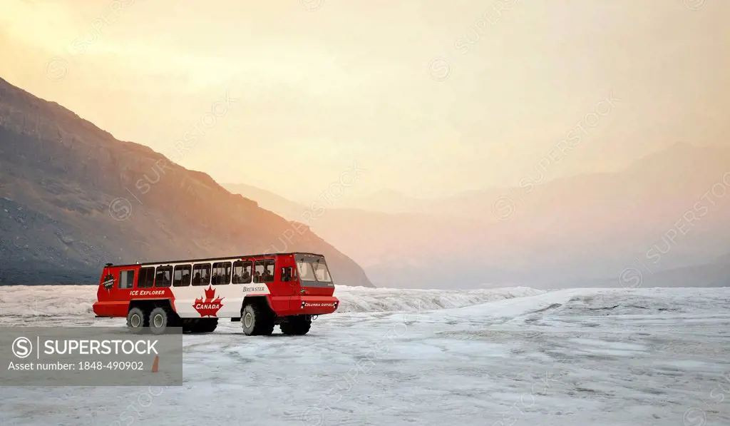 Brewster special bus, Ice Explorer Snowcoach, snowmobile for tourists to explore the glacier, at dusk, Athabasca Glacier, Columbia Icefield, Icefields...