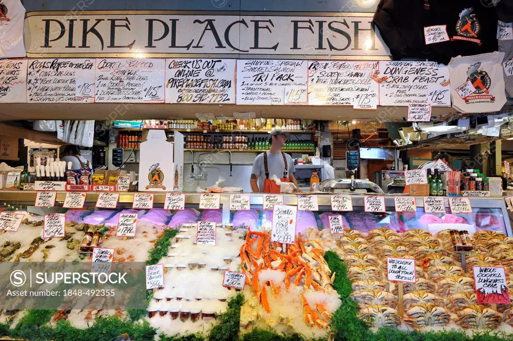Fishmonger, fresh seafood, Dungeness Crabs (Metacarcinus magister), cooked Stone Crab (Lithodidae), Pike Place Public Market, Fish Market, Seattle, Wa...