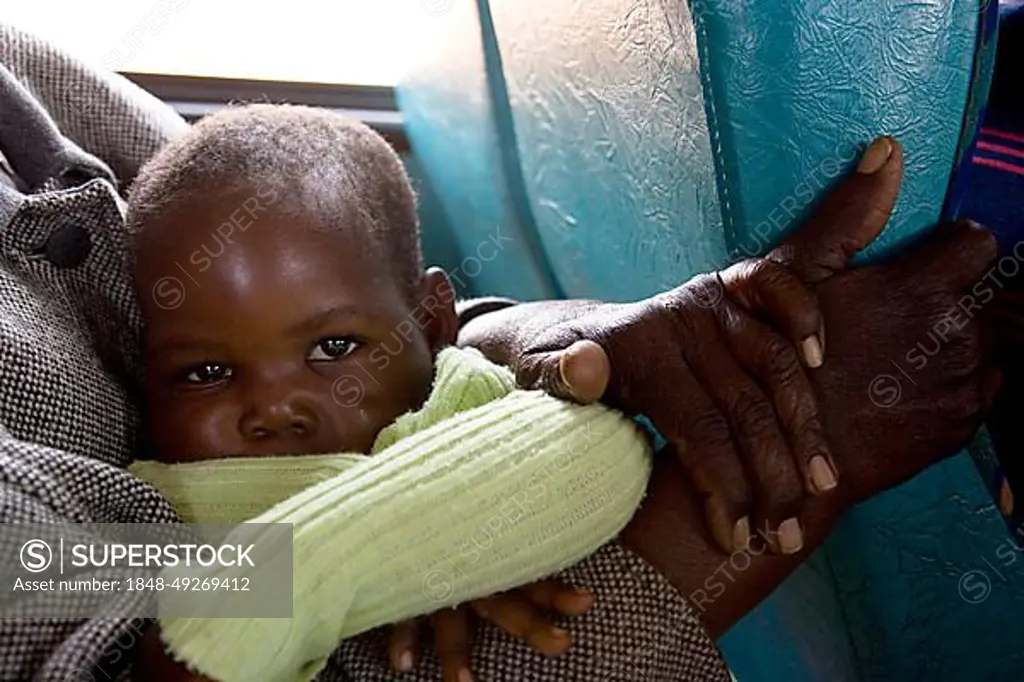African toddler with big eyes on a bus, Botswana, Africa
