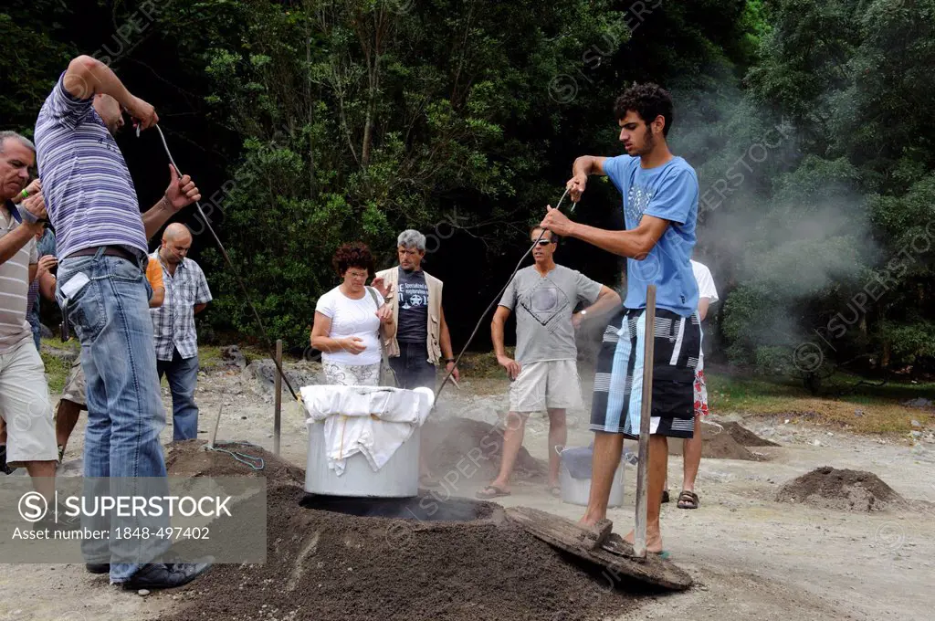 Cooking Cozido, stew, in volcanic soil at Lagoa das Furnas on the island of Sao Miguel, Azores, Portugal