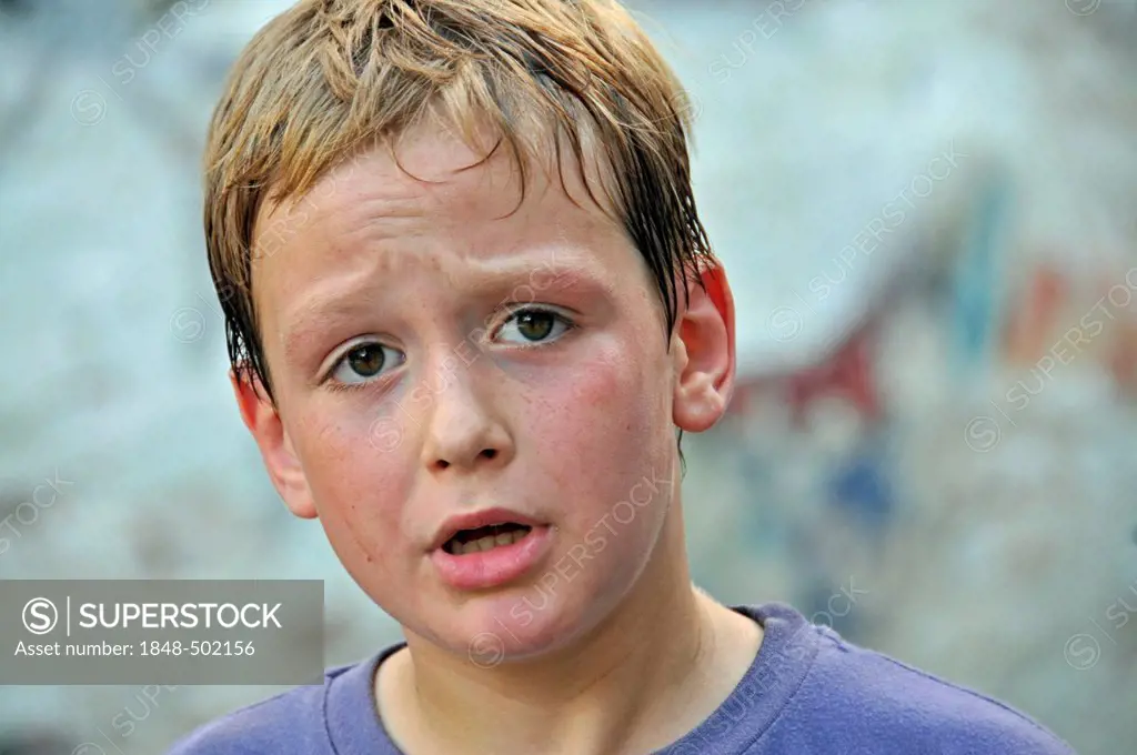 Sweaty 8-year-old boy, football yard in Cologne, North Rhine-Westphalia, Germany, Europe