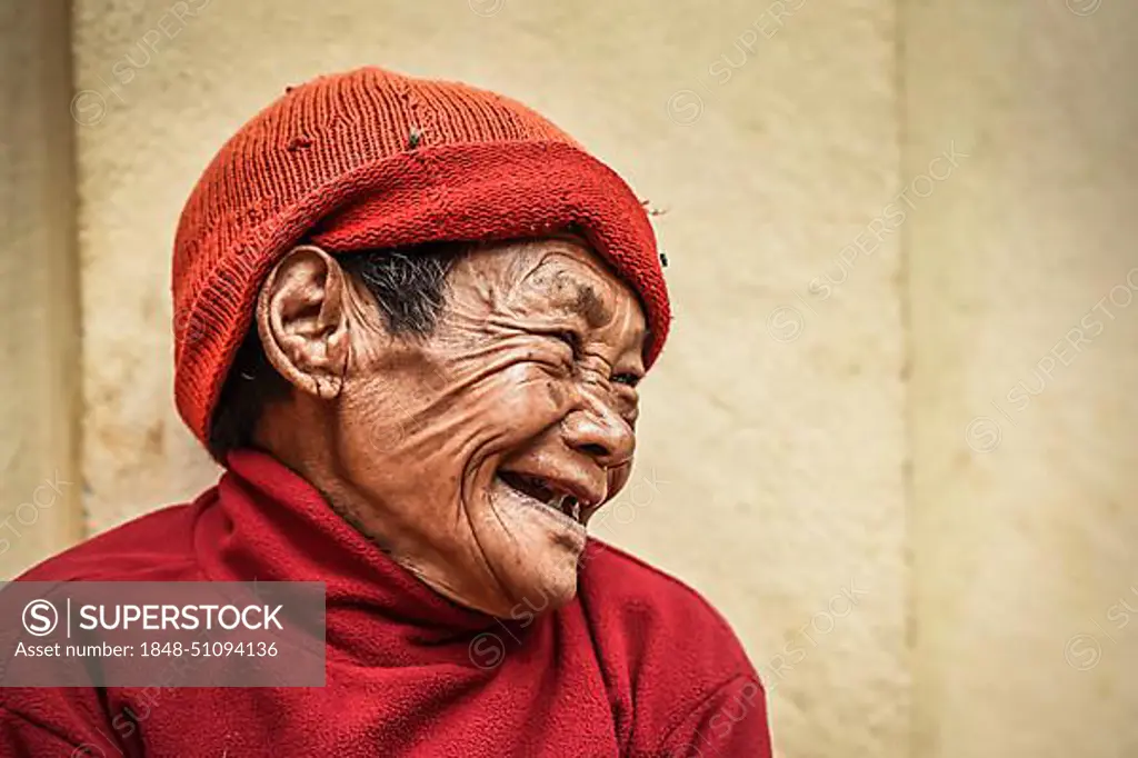 Laughing woman with cap, Bandipur, Kathmandu Valley, Nepal, Asia