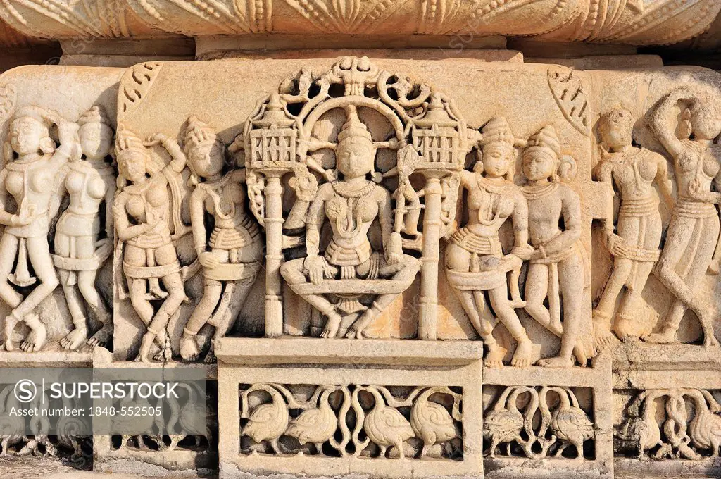 Elaborate frieze with dancers, animals and floral motifs made of marble in the marble Temple of Ranakpur, a temple of the Jain religion, Rajasthan, No...