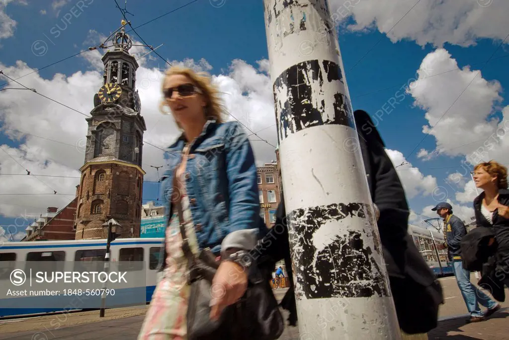 Pedestrian in front of Munttoren, Mint Tower on Muntplein square, Amsterdam, Netherlands, Europe