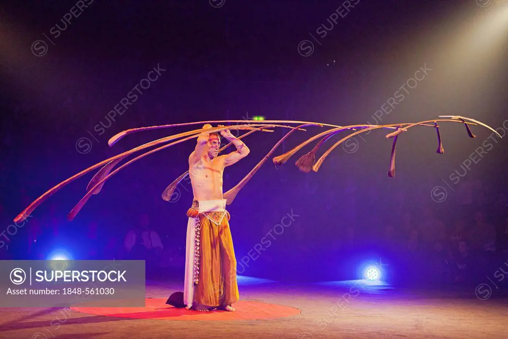 Balancing act where the Swiss performer Rigolo uses 13 palm branches to create a light suspended sculpture, FlicFlac Christmas Circus, premiere of Sch...