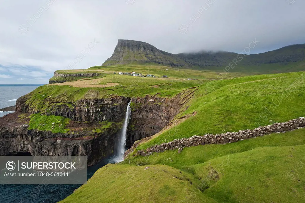 Waterfall into the sea, coast, Gásadalur, Vágar, Faroe Islands, Denmark, North Atlantic