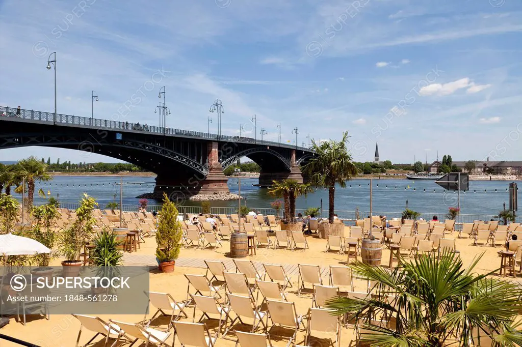 Leisure area with a sandy beach with deck chairs on the bank of the Rhine River, Adenauer-Ufer and Theodor Heuss Bridge, Mainz, Rhineland-Palatinate, ...