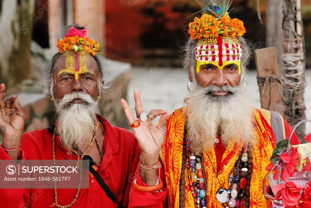 Holy men, Sadhus, with painted faces and long beards, Durbar Square, Kathmandu, Nepal, Asia