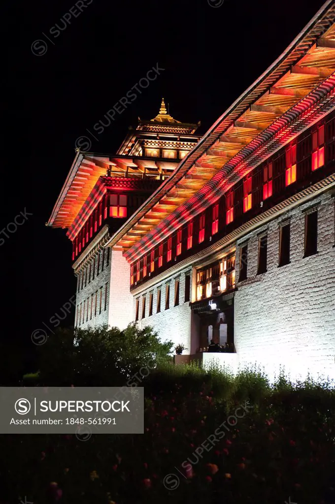 Building illuminated with coloured lights at night, seat of the government, Tashichho Dzong, capital of Thimphu, the Himalayas, Kingdom of Bhutan, Sou...