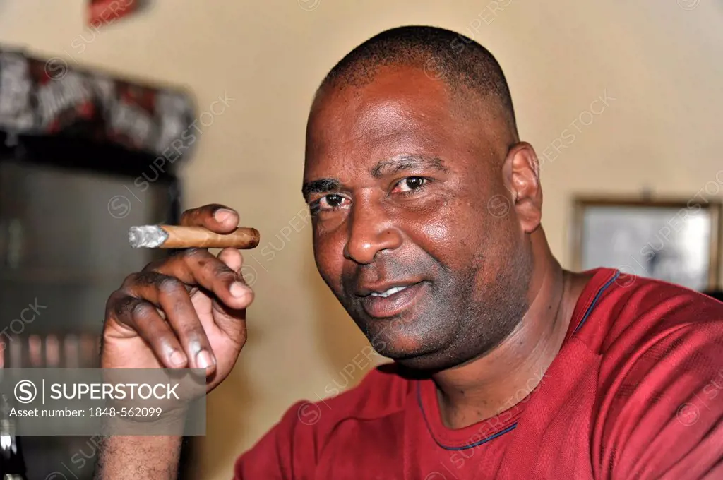 Cuban man smoking a cigar, Santa Clara, Cuba, Greater Antilles, Caribbean, Central America, America