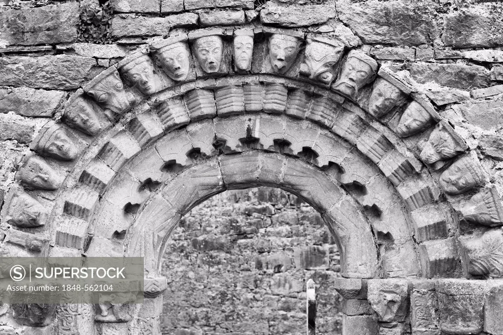 Portal with human masks, church ruins of Dysert O'Dea near Corofin, County Clare, Ireland, Europe