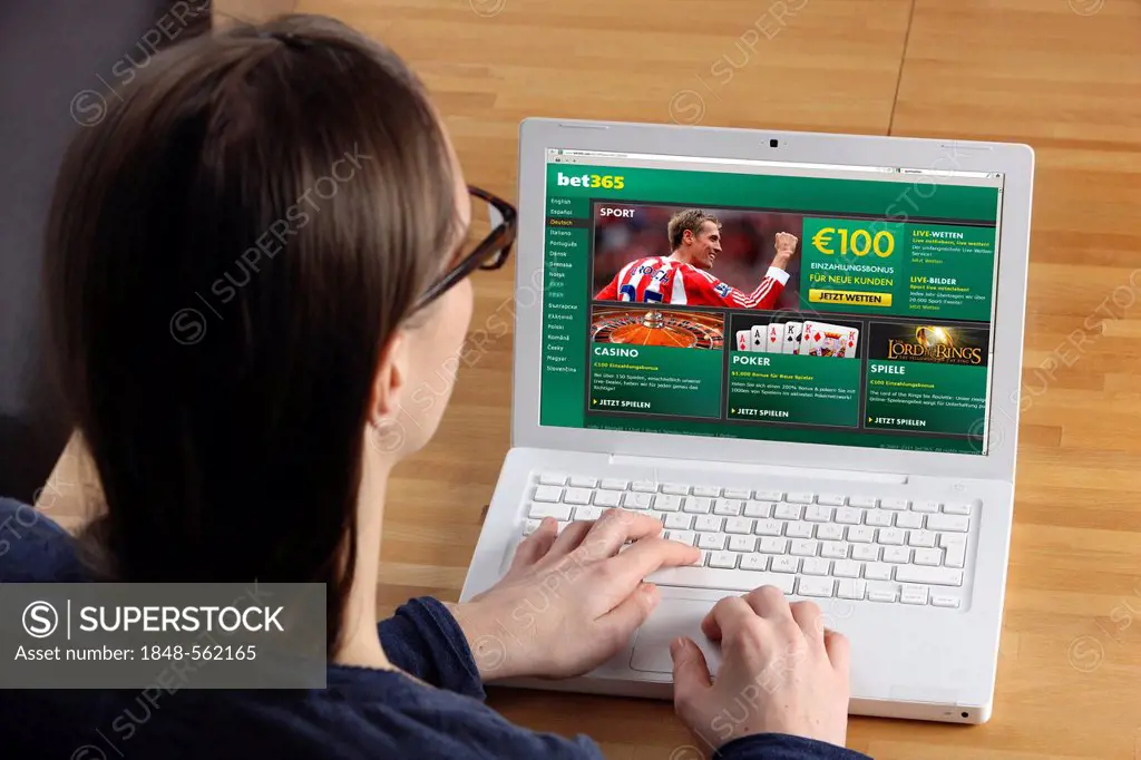 Woman surfing the internet with a laptop, online sports betting, internet betting