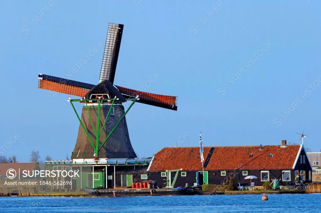 Windmill and house in Zaanse Schans open-air museum, Zaanstad, North Holland, Holland, Netherlands, Europe