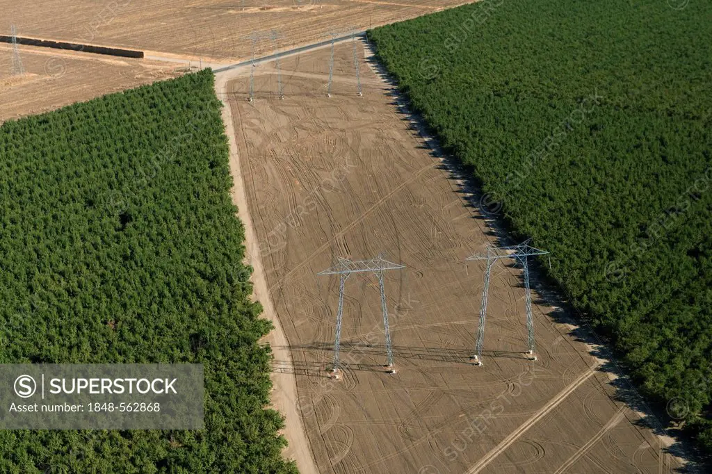 Aerial view of electricity pylons in the agricultural landscape of Central Valley, Fresno, California, USA, North America